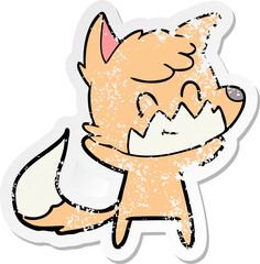distressed sticker of a cartoon happy fox