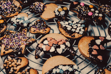 christmas cookie covered with chocolate and sugar. a christmas cookie background in retro colors. vintage christmas cookie close up