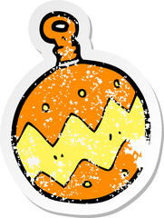 retro distressed sticker of a cartoon christmas bauble