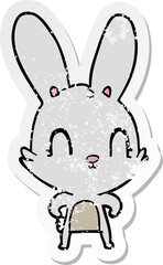 distressed sticker of a cute cartoon rabbit