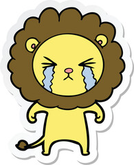 sticker of a cartoon crying lion