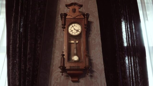 Antique wall clock with a pendulum.