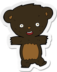 sticker of a cartoon teddy black bear cub