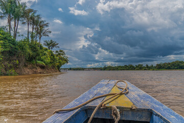 Fototapeta na wymiar Sail along the Amazon in a wooden boat