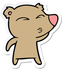 sticker of a cartoon whistling bear