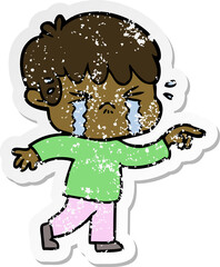 distressed sticker of a cartoon boy crying