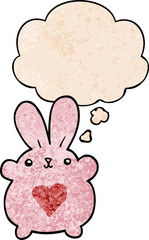 cute cartoon rabbit with love heart and thought bubble in grunge texture pattern style