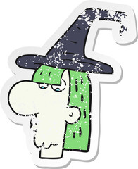 retro distressed sticker of a cartoon witch head