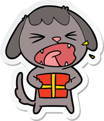 sticker of a cute cartoon dog with christmas present