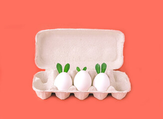 Easter eggs on apricot crush background. Happy Easter concept. Bold hues for seasonal projects. Copy space