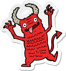 sticker of a cartoon demon