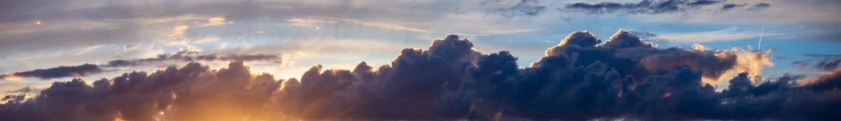 Obraz premium Sky panorama. Beautiful dramatic big clouds in the sky. Landscape of the power of heaven and nature. Copy space