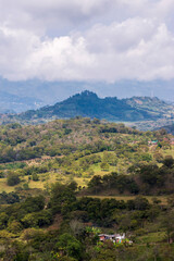 Beautiful rural landscape. Hill covered with trees. Colombia.