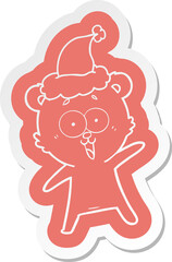 laughing teddy  bear cartoon  sticker of a wearing santa hat