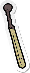 sticker of a cartoon burnt match