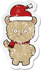 retro distressed sticker of a cartoon christmas teddy bear