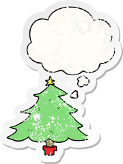 cartoon christmas tree and thought bubble as a distressed worn sticker