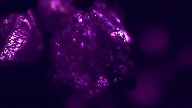 Nuclear radioactive fusion energy cell. Futuristic purple concept 3D animation loop of rotating glowing nucleus as quantum antimatter or dark matter particle, and futuristic energy source.