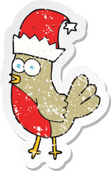 retro distressed sticker of a cartoon robin in christmas hat