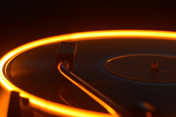 Burning in the dark vinyl disc long exposure photo music theme for parties with DJs audio and sound...