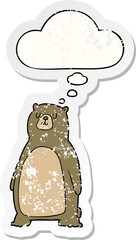 cartoon bear and thought bubble as a distressed worn sticker