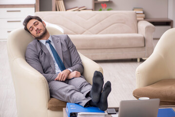 Young male employee working from home