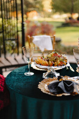 Wedding table setting. Gold dishes