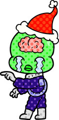 comic book style illustration of a big brain alien crying and pointing wearing santa hat