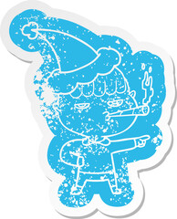 cartoon distressed sticker of a man smoking wearing santa hat