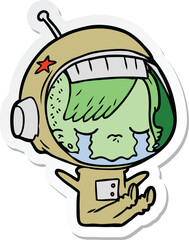 sticker of a cartoon crying astronaut girl