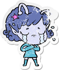 distressed sticker of a cartoon crying alien girl