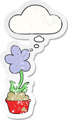 cute cartoon flower and thought bubble as a distressed worn sticker