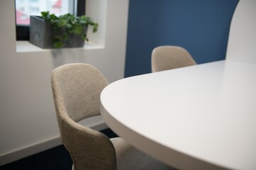 Modern meeting room interior with table and chairs
