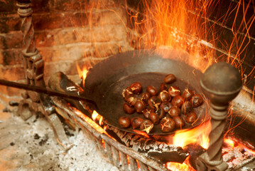 Chestnuts roasting on an open fire.