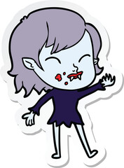 sticker of a cartoon vampire girl with blood on cheek