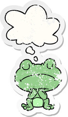 cartoon frog and thought bubble as a distressed worn sticker