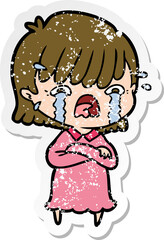 distressed sticker of a cartoon girl crying