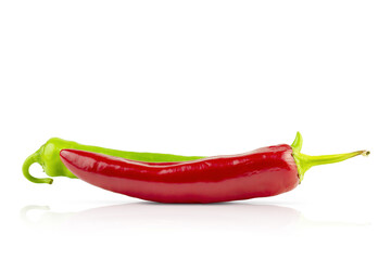 Isolated peppers on a white background with space for text. green and red chili peppers, diet food, veganism. Healthy seasoning for cooking