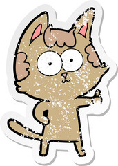 distressed sticker of a happy cartoon cat