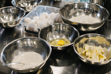 Ingredients for baking cakes close-up, eggs, butter, milk, sugar.