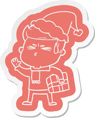 cartoon  sticker of a man sweating wearing santa hat
