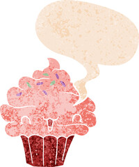 cute cartoon frosted cupcake and speech bubble in retro textured style