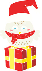 flat color illustration of a cartoon cute christmas owl on wrapped present