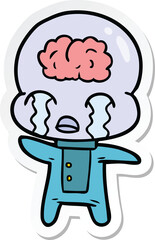 sticker of a cartoon big brain alien crying
