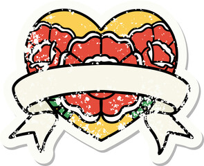 traditional distressed sticker tattoo of a heart and banner with flowers