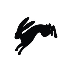 Silhouette of a hopping hare, rabbit, and bunny isolated on white background. Symbol of Easter.