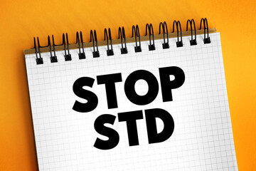Stop STD (Sexually transmitted diseases) text on notepad, concept background