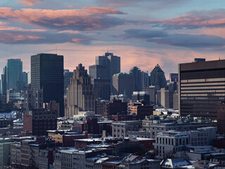 Fototapeta na wymiar Montreal skyline at sunset on a winter day with visible snow