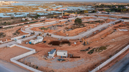 Obraz premium Construction site with dug ditches for the infrastructure of residential buildings.