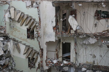 remnants of partially destroyed building, debris, demolition